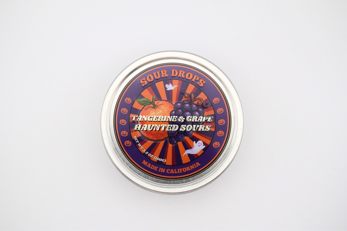 Tangerine & Grape Haunted Sours Halloween tin with tangerine, grapes, ghosts and pumpkins on the lid, made in California
